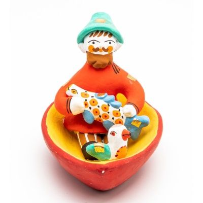 Фигурка "Мужик в лодке с рыбой и птичкой"