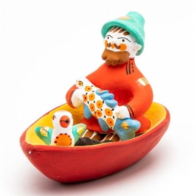 Фигурка "Мужик в лодке с рыбой и птичкой"