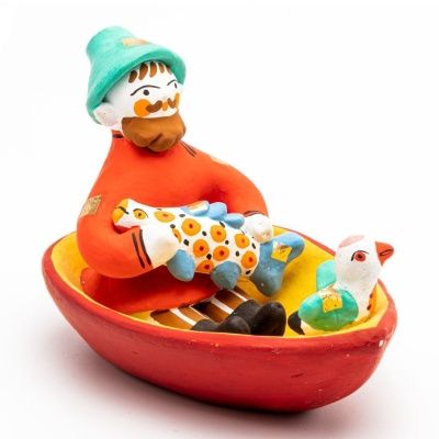 Фигурка "Мужик в лодке с рыбой и птичкой"
